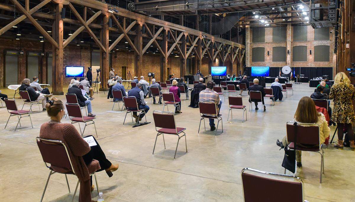 Downtown business owners and Columbus residents attend a meeting at the Columbus Convention and Trade Center Tuesday night to hear updates and provide input about parking in the downtown area.