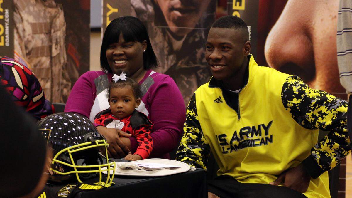 Carvers Jawon Pass is joined by his sister Triniti Pass and cousin Kinsley Thomas (baby).