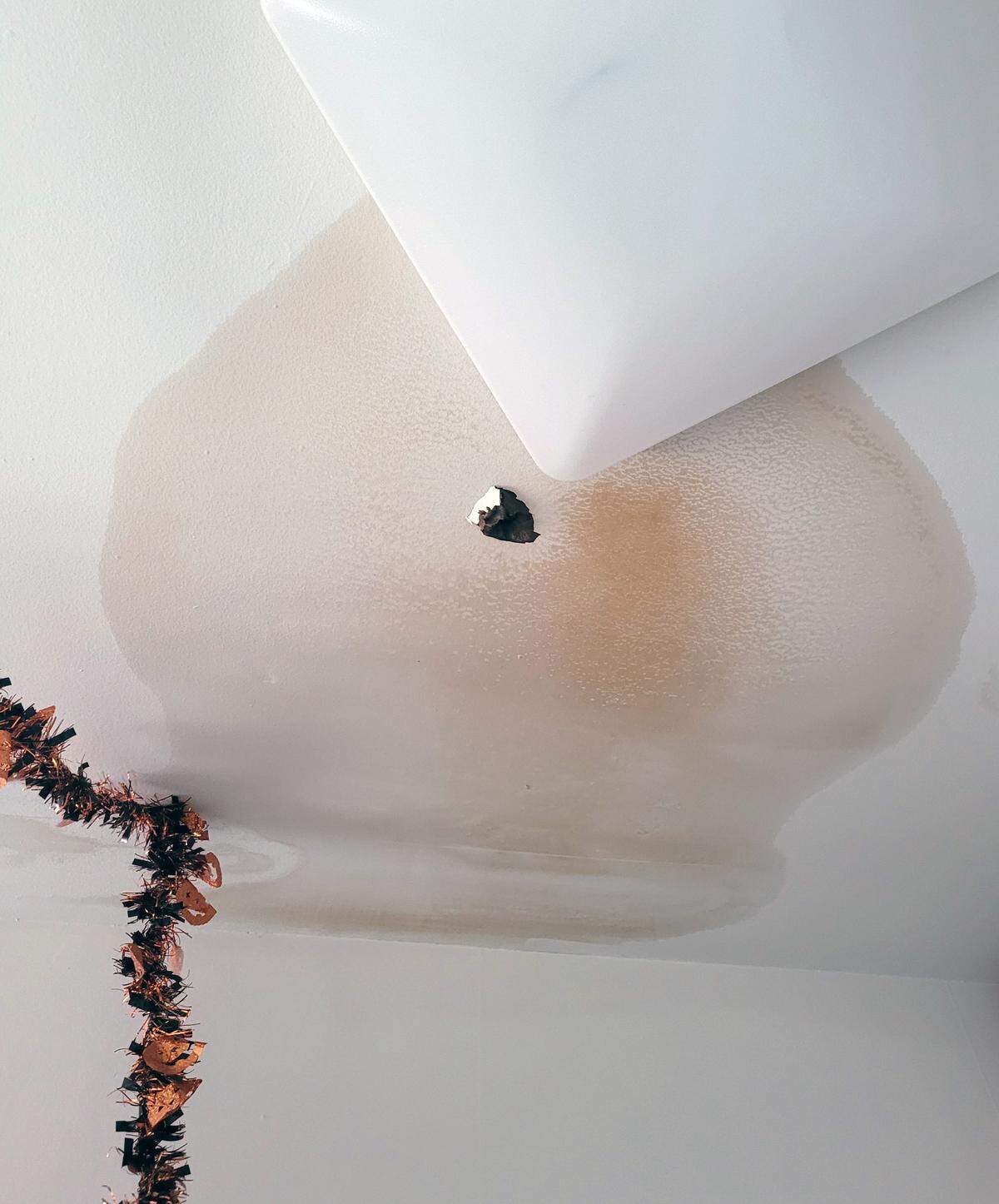 Columbus resident Chelle Leary took this photo of a bullet hole in her ceiling, the result of a bullet entering her apartment on New Year’s Eve.