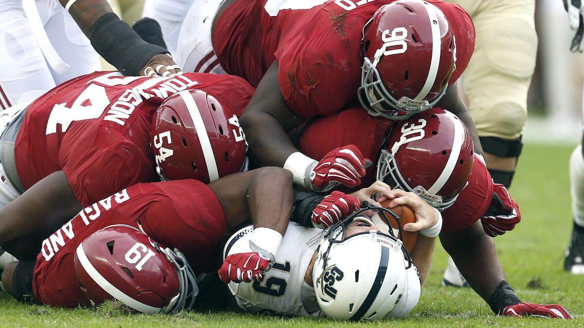Alabama linebacker Reggie Ragland (19), defensive lineman Dalvin Tomlinson (54), defensive lineman Jarran Reed (90), and linebacker Denzel Devall (30) sack Charleston Southern quarterback Kyle Copeland (19) for a loss during the first half of an NCAA football game, Saturday, Nov. 21, 2015, in Tuscaloosa, Ala. (AP Photo/Butch Dill)