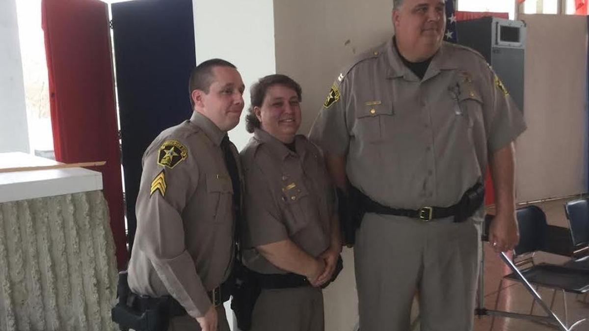 From left, Sgt. Wayne Brassard, Lt. Cynthia Zeisloft and Capt. Chuck Pickett pose for photo after promotion ceremony Tuesday at the Government Center.