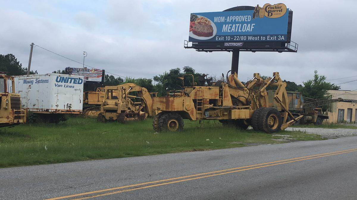 This huge loader parked along Farr Road is still operational and in compliance with a solid waste ordinance, according to the owner of the property and city official.
