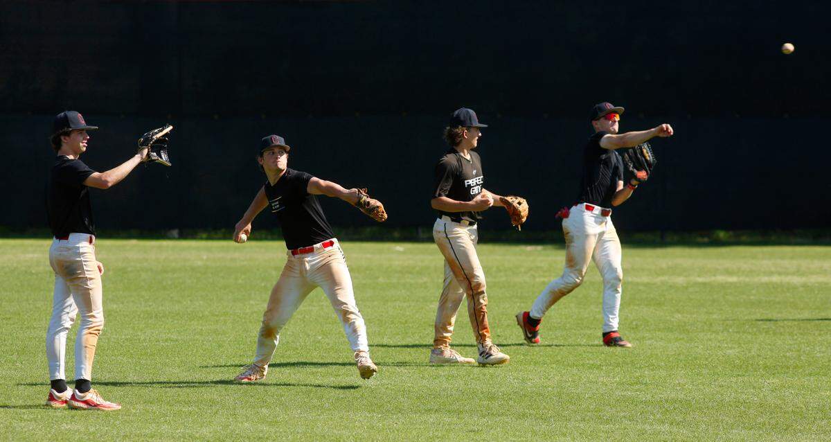 Baseball players at Central High School in Phenix City warm up their throwing arms during practice Monday afternoon. 04/15/2024