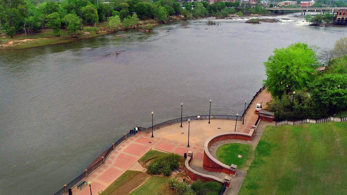 This is a view looking northwest over the Chattahoochee River, with the Columbus Riverwalk in the foreground.