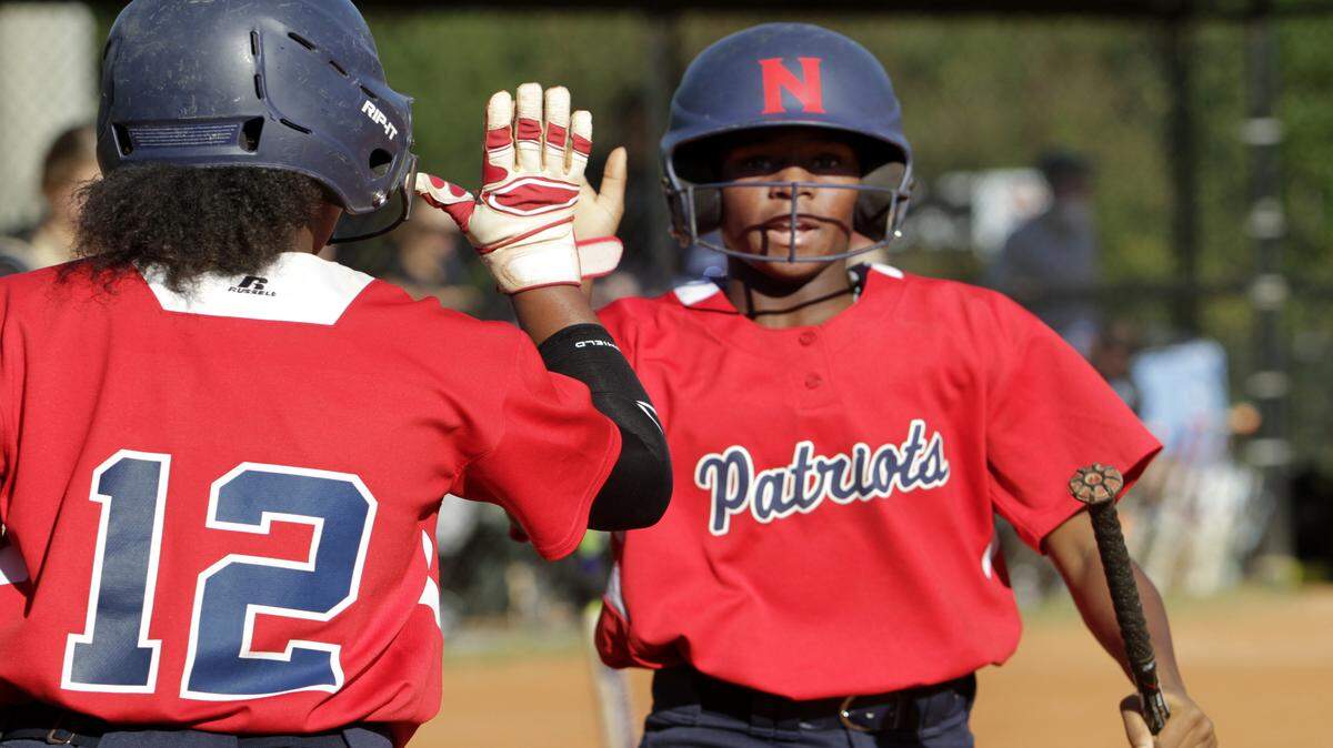 ROBIN TRIMARCHI rtrimarchi@ledger-enquirer.comNorthside's Kennedi Bedell, right, is met by teammate Hannah George after scoring against Starr's Mill in game three of GHSA first round state tournamet play Thursday at Northside.  10.15.15