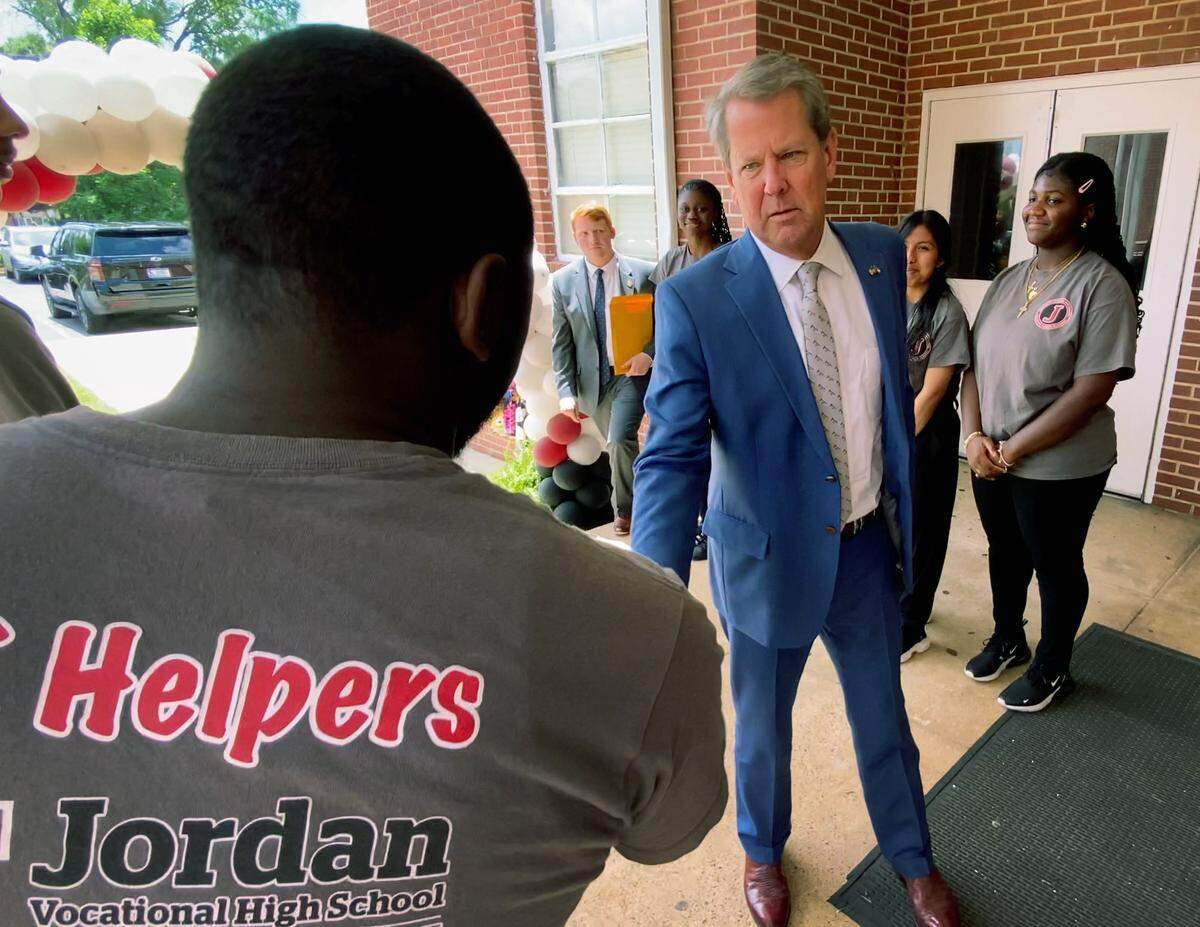 Jordan Vocational High School students greet Georgia Governor Brian Kemp Thursday afternoon. Kemp signed a series of bills promoting workforce development and economic opportunity while at the school. Kemp was joined by First Lady Marty Kemp, members of the General Assembly and local leaders in the school’s mechatronics lab. 05/02/2024