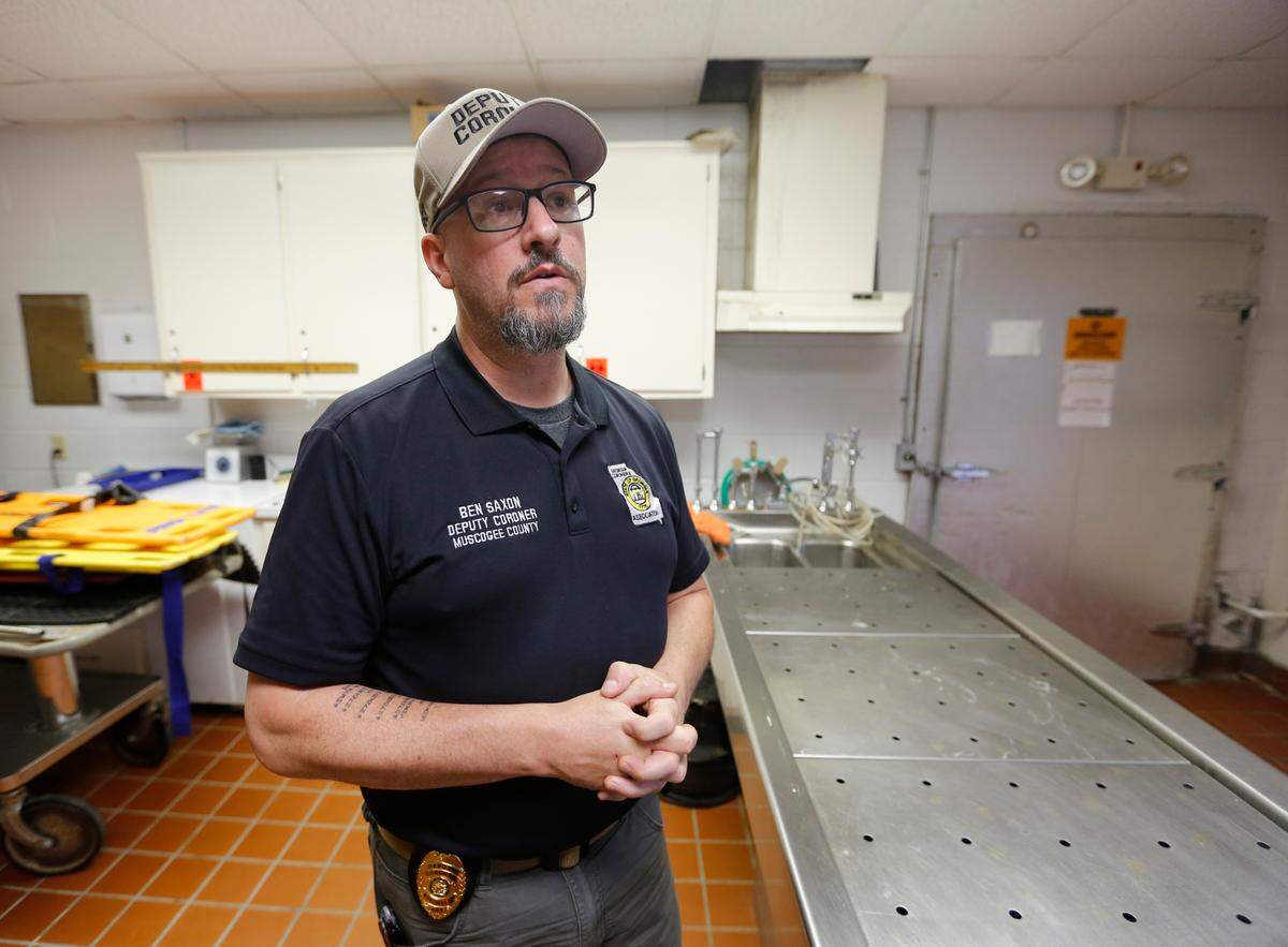 Ben Saxon, a deputy coroner in Muscogee County, Georgia, answers questions about the morgue and transport system. 03/10/2023
