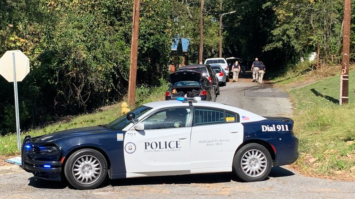 Columbus police investigate a wooded area off Magnolia Avenue where a body was found.