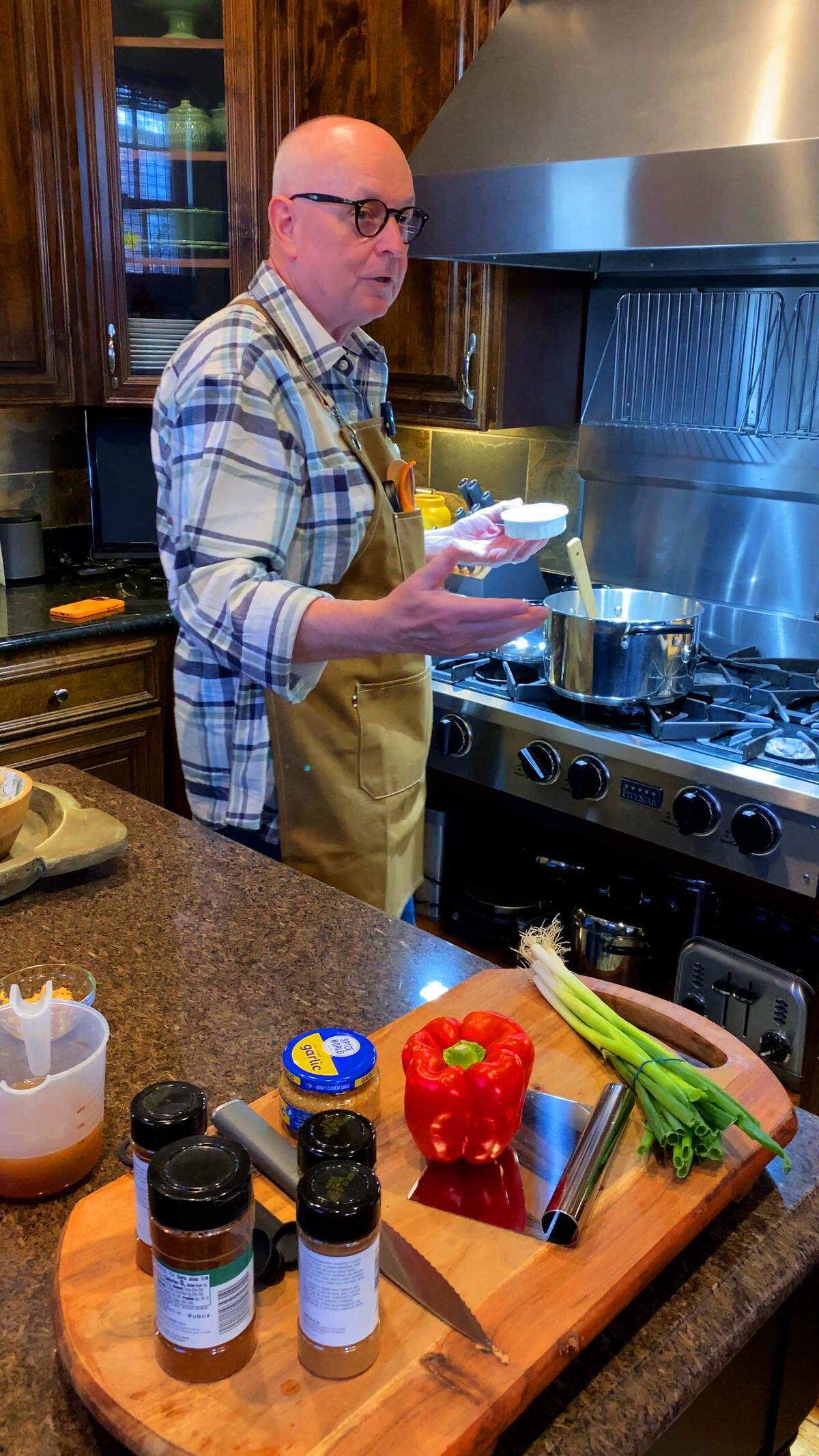 Peter Bowden, retired president and CEO of VisitColumbusGA, talks about his passion for food and cooking as he prepares a pot of Christmas chili during a Dec. 10, 2025, interview with the Ledger-Enquirer in his kitchen.