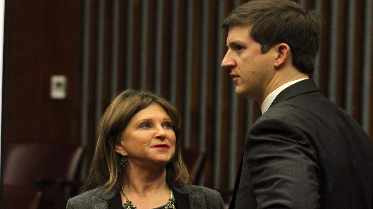 Superior Court Clerk Linda Pierce talks with one of her attorneys, James Stone, during court in a hearing this year in the lawsuit over her budget.