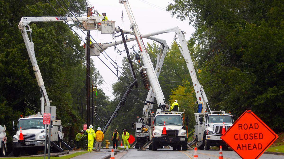 Norris Road at the intersection with Fuller Street was blocked off Thursday as crews from AT&T and Service Electric Company worked to repair a utility poll that was broken in half and caused a power outage in the area.