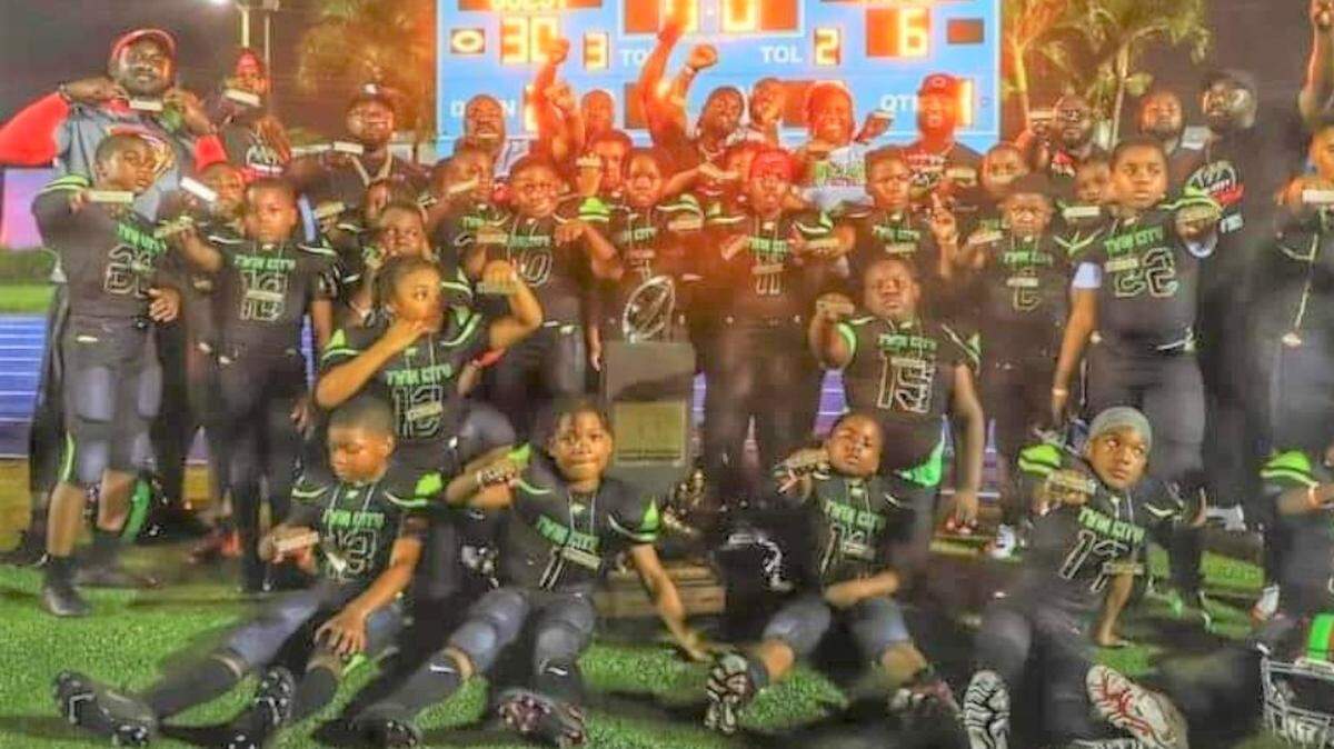 The Twin City Outlaws youth football team, representing Columbus and Phenix City, won the age 8-and-under division national title with a 30-6 victory over the Georgia Eagles of Atlanta on Dec. 11 at Nathaniel “Traz” Powell Stadium in Miami, Florida.