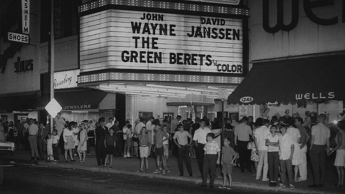 People wait in line outside the Bradley Theater in downtown Columbus, GA, to watch a showing of “The Green Berets.”