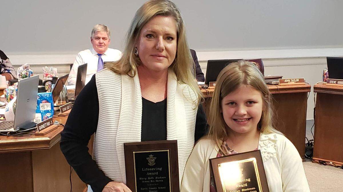 Harris County School District bus driver Mary Beth Hudson and Mulberry Creek Elementary School fourth-grader Kaitlyn Blackmon were honored during the Nov. 1, 2018, meeting of the Harris County Board of Education for saving the life of a choking student.