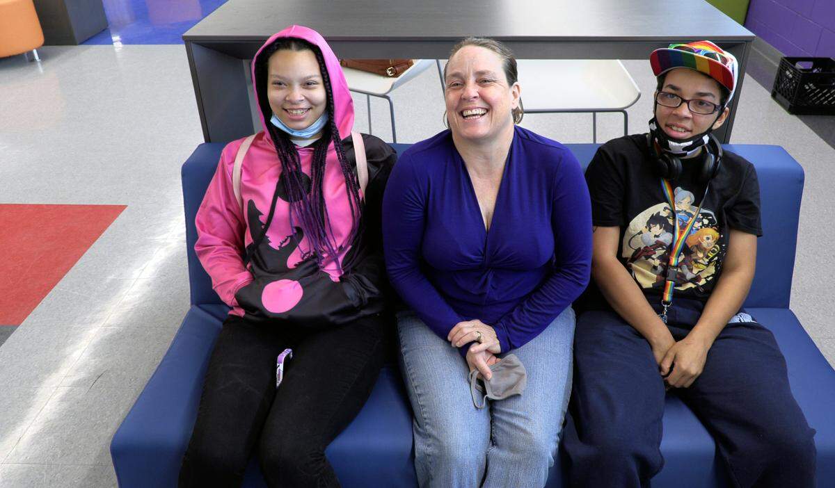 Lynette Poindexter, center, and her daughters Virginia Jones, left, and Heather Jones answer questions about their experiences at the Boys & Girls Clubs.