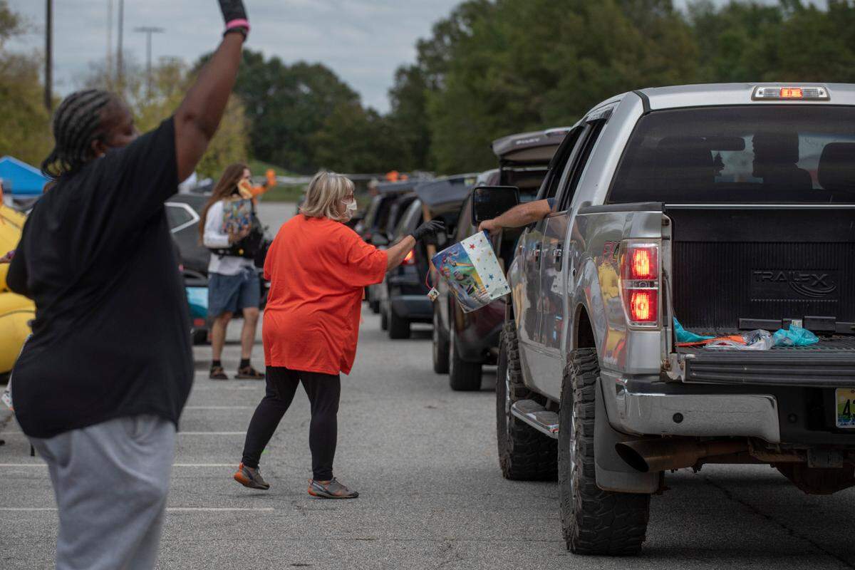 Thousands of pounds of candy is distributed during the Spooktacular Trunk or Treat event on Sunday, Oct. 25, 2020 at the Civic Center in Columbus.