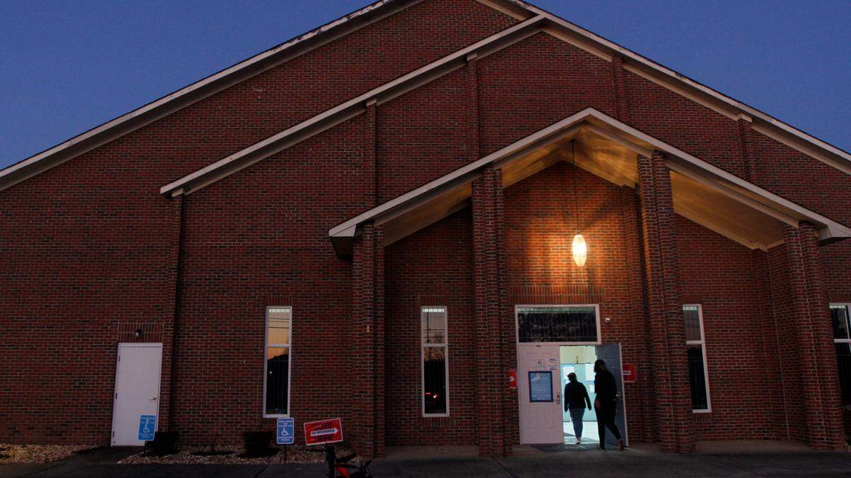 Two voters enter the voting precinct in this L-E file photo.