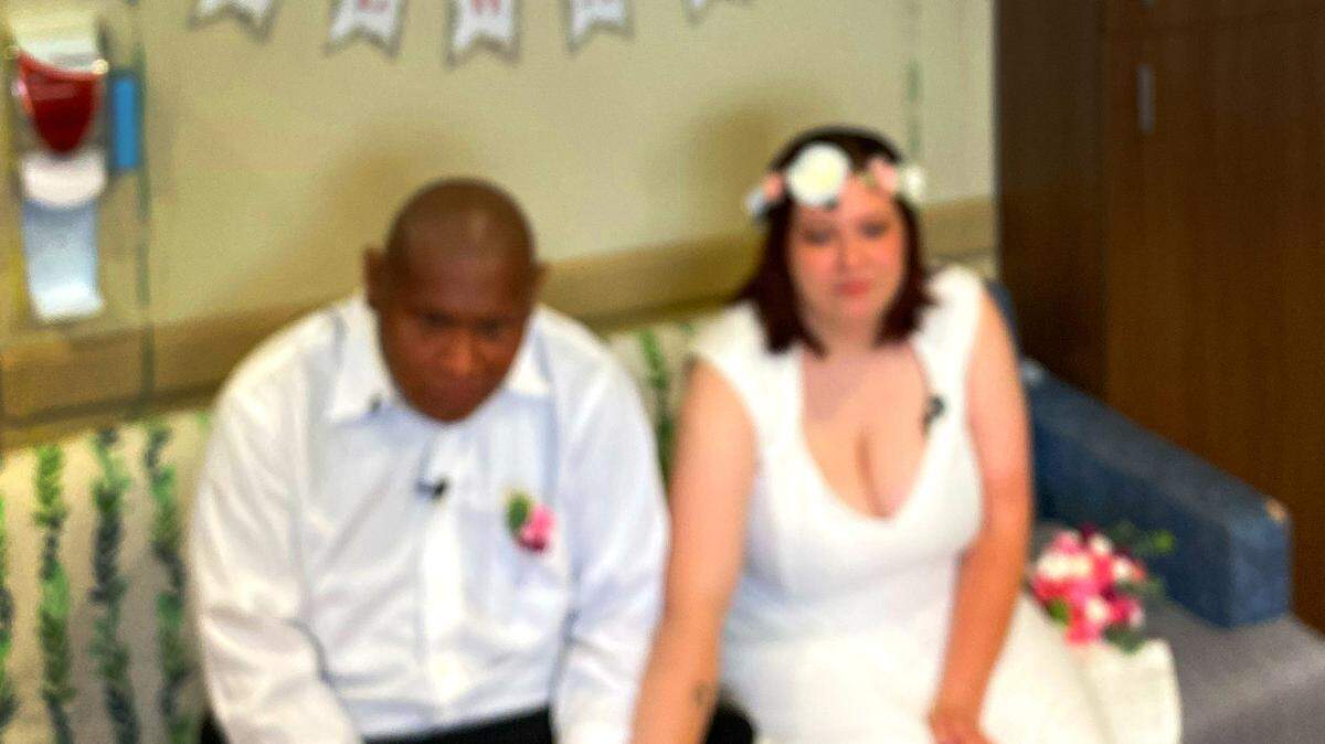 Alexander Santos and his wife Heather answer questions from the media after the couple was married at Piedmont Columbus Regional’s Midtown Campus Wednesday afternoon. 07/20/2023