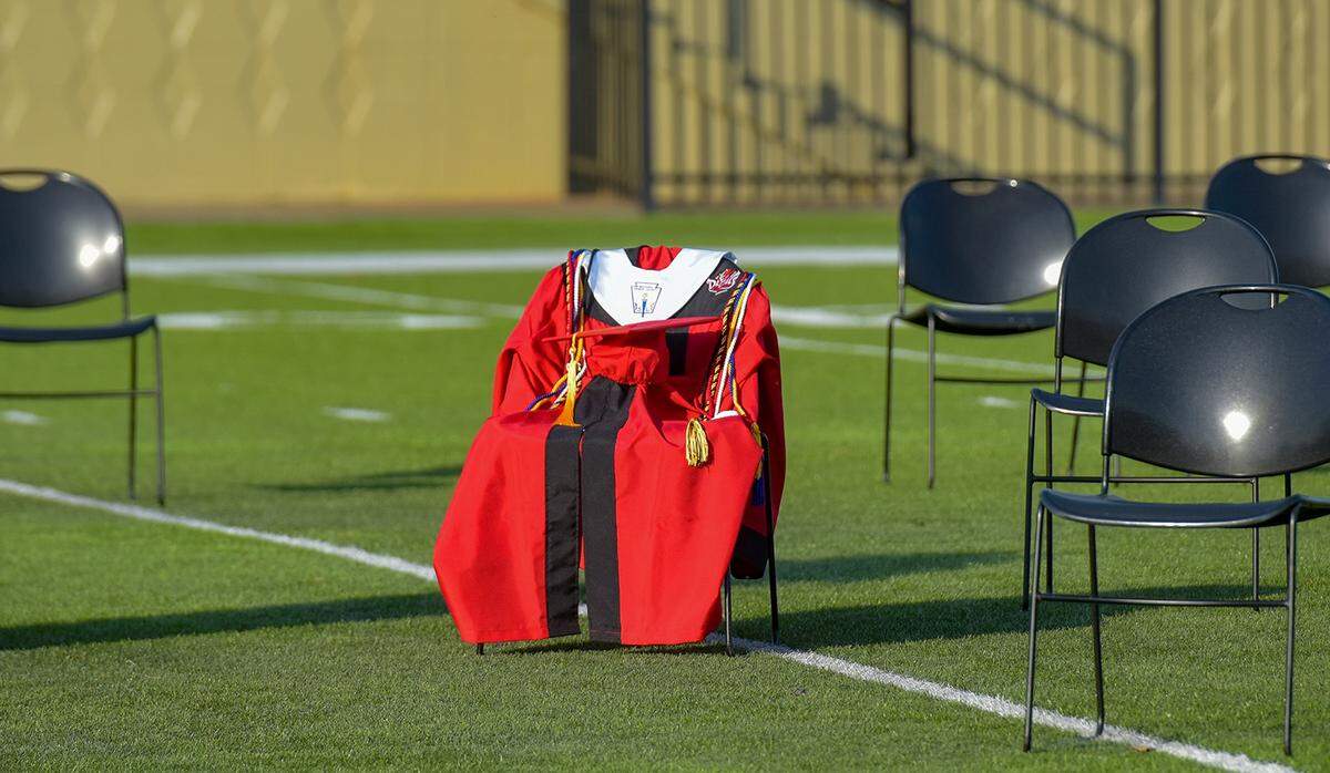 A graduation cap and gown were placed in honor of Chris Rogers, senior class president at Central High School in Phenix CIty, Alabama at Central’s graduation ceremony Wednesday night at Garrett-Harrison Stadium. Rogers died in an auto accident in August 2019.