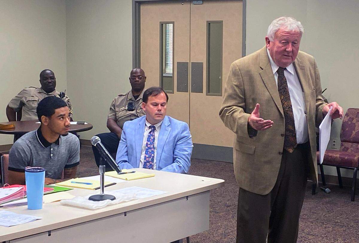 Left to right, Zajaliq Stpaul Riley and attorney Sam Kennedy listen as Riley’s lead defense attorney Michael Garner speaks to jurors. Riley is accused of killing 20-year-old Devion Miley on May 8, 2021. 08/07/2023