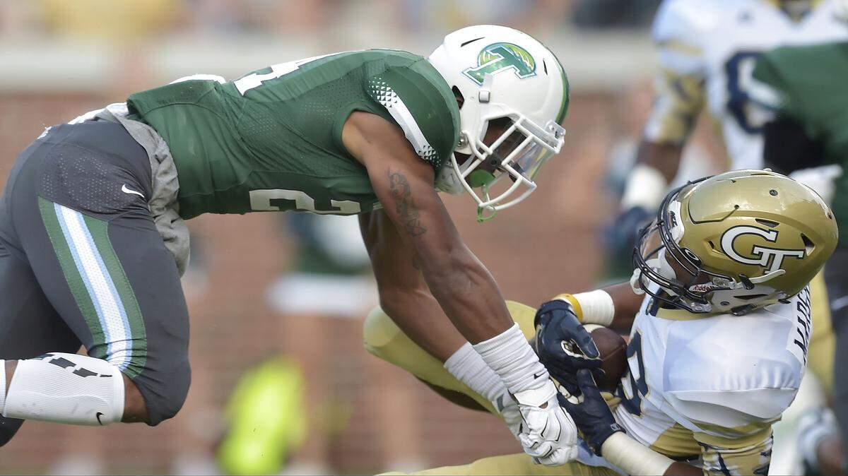 MIKE STEWART/Associated PressGeorgia Tech running back TaQuon Marshall (Harris County) makes a touchdown catch against Tulane safety Malik Eugene during the second half Saturday in Atlanta. Georgia Tech won 65-10.