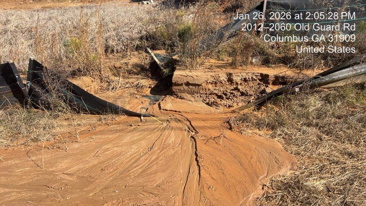 Silt running over fencing from the Aspire at Old Guard construction site is pictured Jan. 26, 2026. The Chattahoochee Riverkeeper claims these conditions violate best management practices and pollutes water tributaries to the Chattahoochee River.