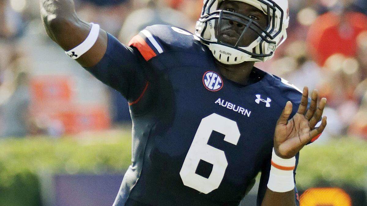 Auburn quarterback Jeremy Johnson (6) throws a first down during the first half of an NCAA college football game against Western Carolina in Auburn, Ala., Saturday, Oct. 12, 2013. (AP Photo/Dave Martin)