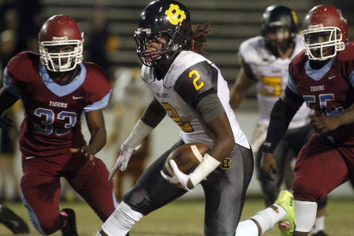 Harris County running back Tae Crowder makes a play against the Carver Tigers in 2014.