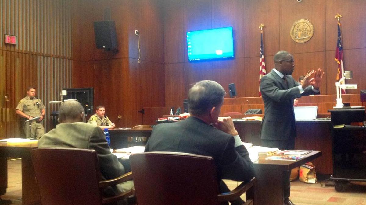 Prosecutors Al Whitaker and George Lipscomb watch as attorney Stacey Jackson makes his closing argument.