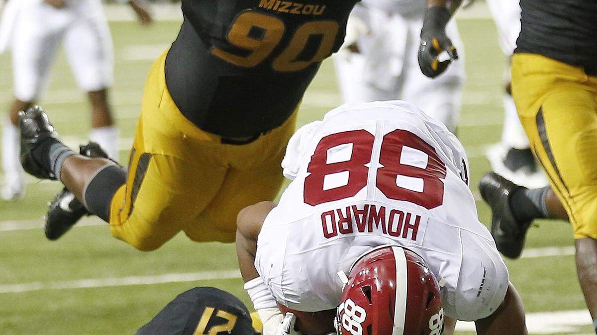Missouri defensive lineman Harold Brantley (90) prepares to tackle Alabama tight end O.J. Howard (88) during the first half of the Southeastern Conference championship NCAA college football game, Saturday, Dec. 6, 2014, in Atlanta. (AP Photo/John Bazemore)
