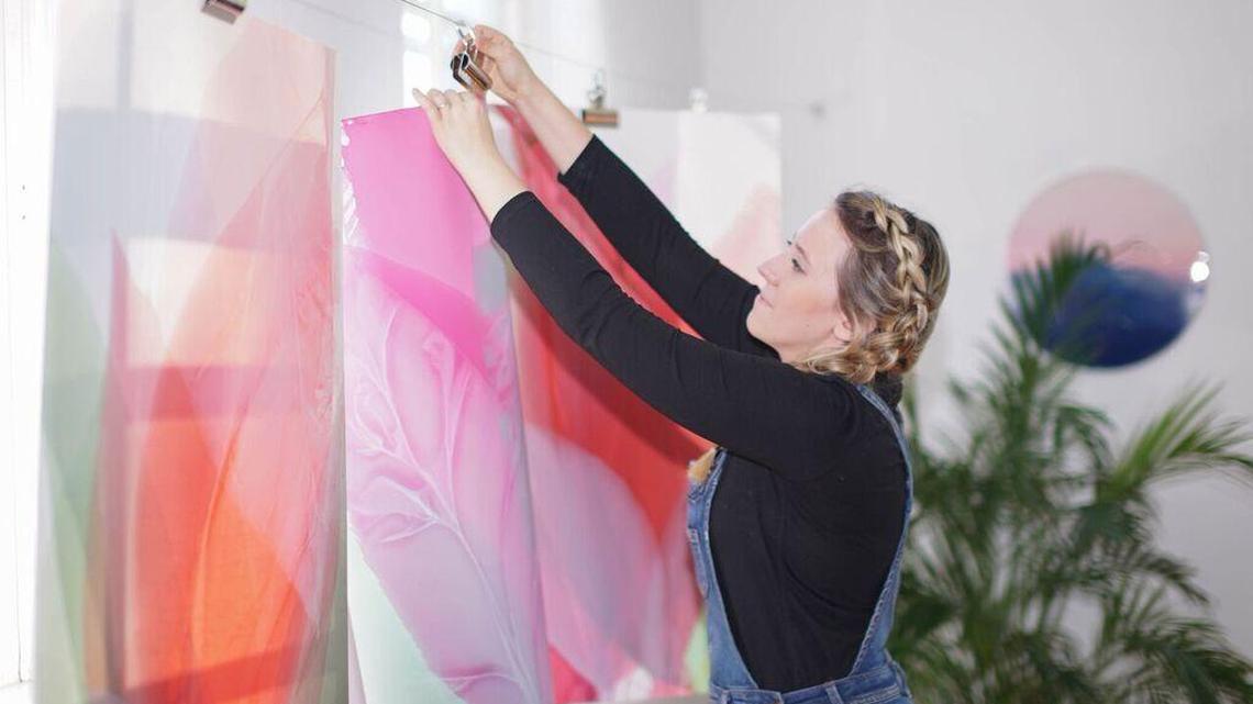 Local artist Marina Dunbar at work in her studio.