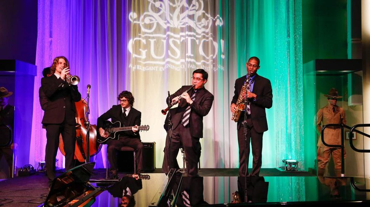 An ensemble of students entertains patrons at “GUSTO!”