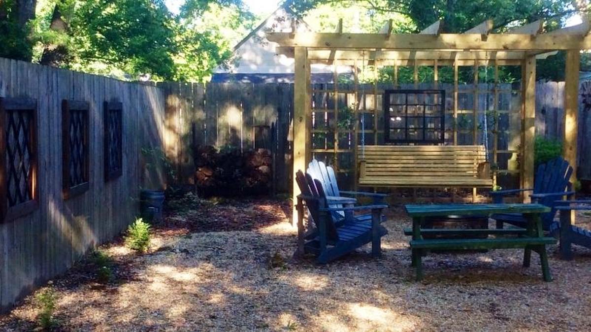 The yard art and fire pit gathering at home of Hallie Fivecoat is part of 2017 Keep Columbus Beautiful Tour of Gardens and Outdoor Spaces.