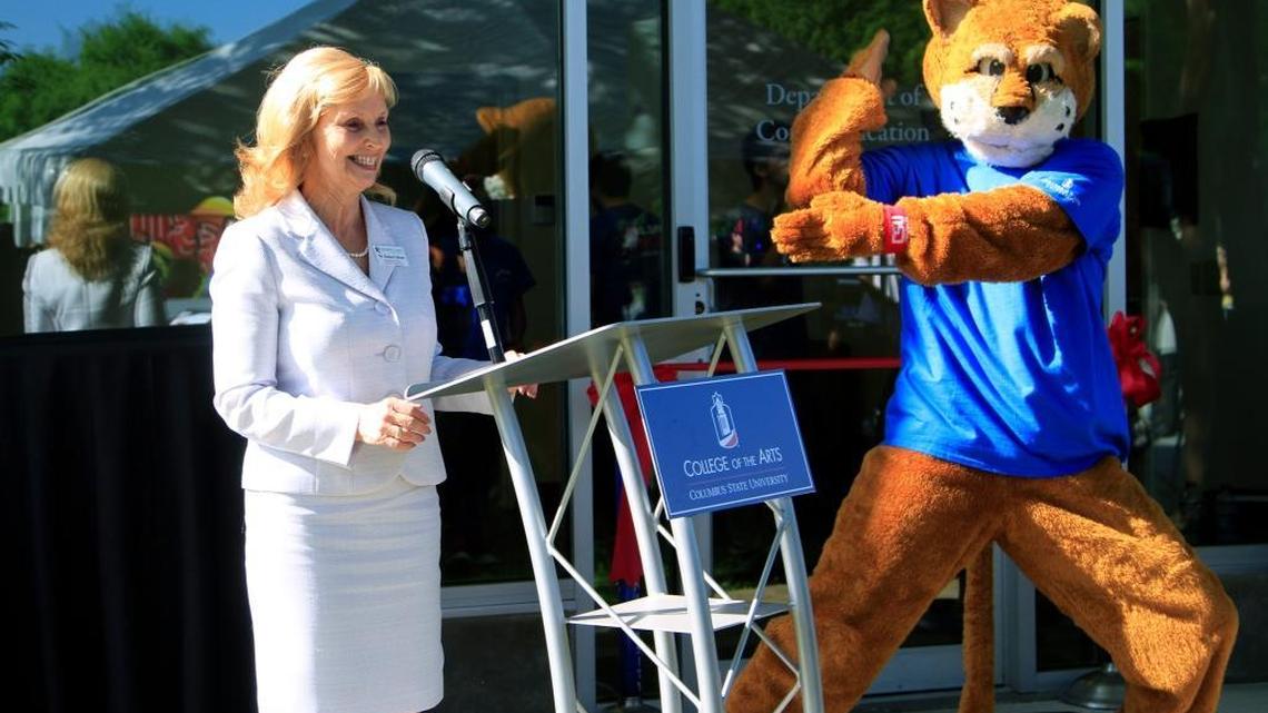 Danna Gibson is chair of the department of communication at Columbus State University. She is shown with Cody the Cougar during a ribbon-cutting and launch celebration for 88.5 WCUG Cougar Radio on April 21.