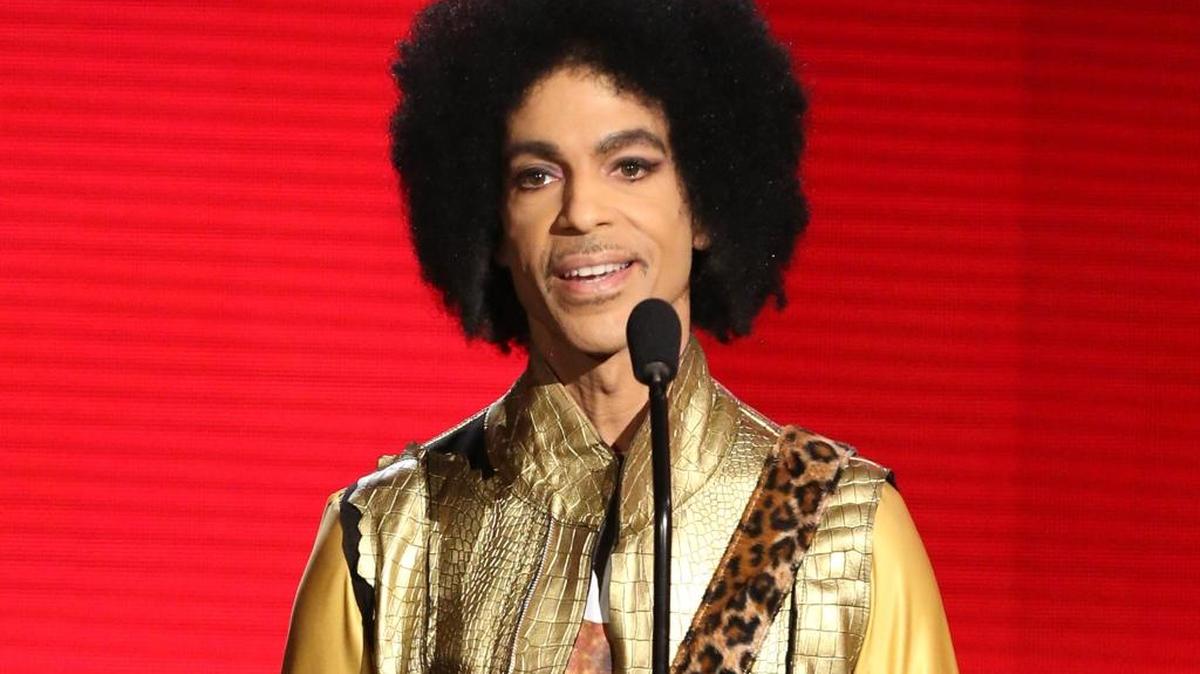 FILE - In this Nov. 22, 2015 file photo, Prince presents the award for favorite album - soul/R&B at the American Music Awards in Los Angeles. Prince, widely acclaimed as one of the most inventive and influential musicians of his era with hits including "Little Red Corvette," ''Let's Go Crazy" and "When Doves Cry," was found dead at his home on Thursday, April 21, 2016, in suburban Minneapolis, according to his publicist.