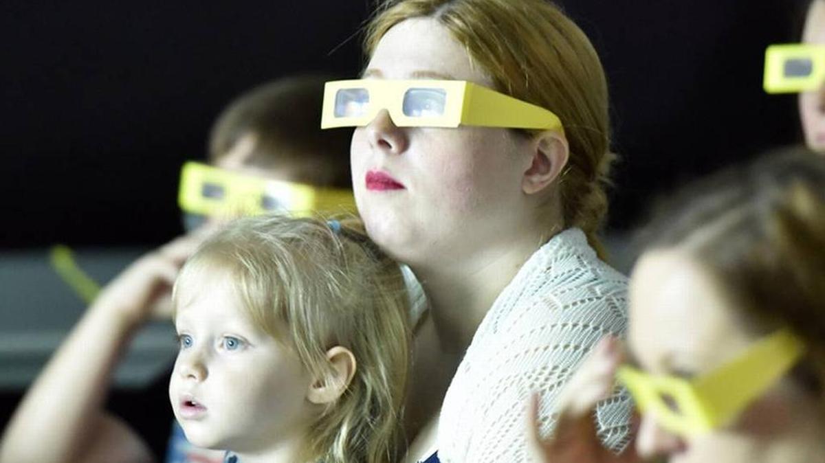 Children and parents enjoy an event at the Coca-Cola Space Science Center.