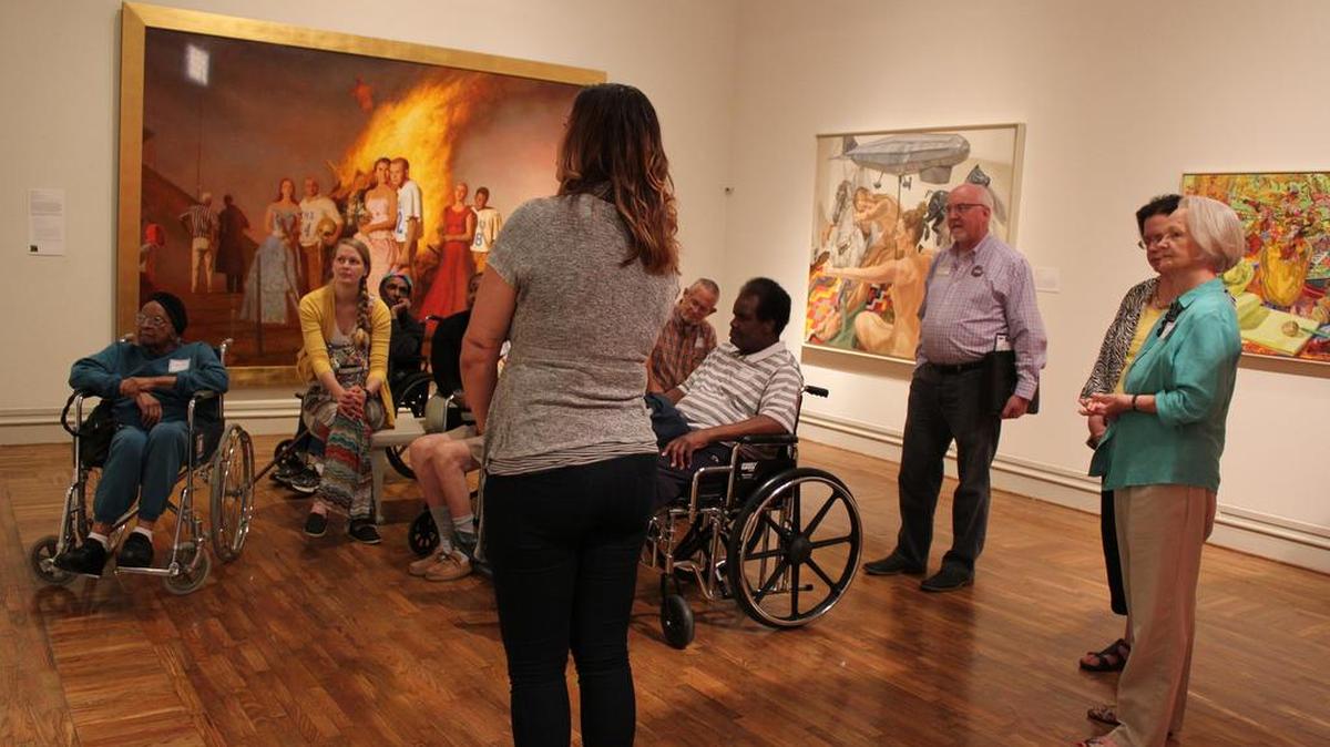 Patrons enjoy a tour of the Columbus Museum.