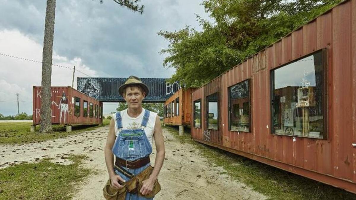 Folk artist Butch Anthony poses at his Museum of Mystery in Seale, Ala.