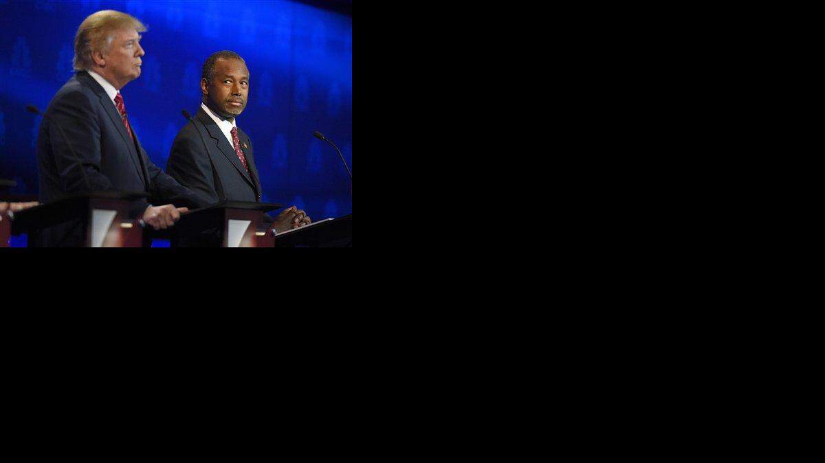 GOP presidential candidates Donald Trump and Ben Carson at CNBC debate.