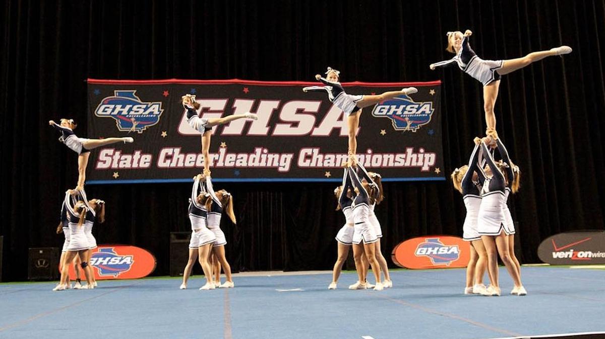 A cheerleading team competes in a past Georgia High School Association State Cheerleading Championships session at the Columbus Civic Center. --