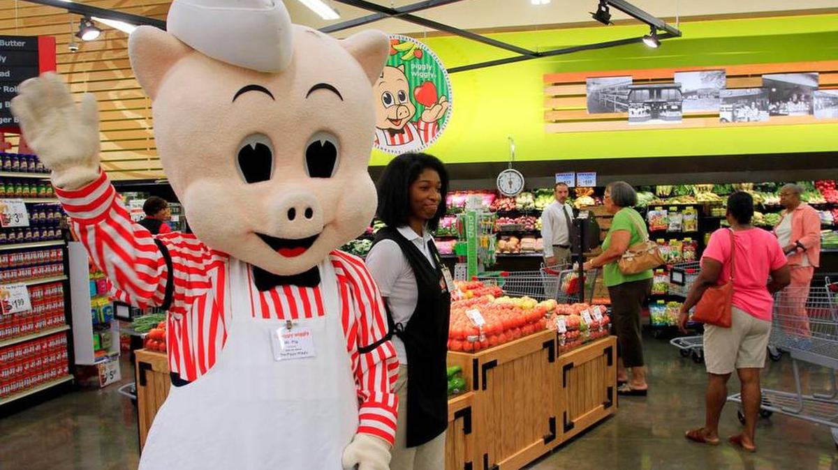 In this Sept. 9, 2015, file photo, “Mr. Pig” greets customers as they shop at the Piggly Wiggly at 2424 Woodruff Farm Rd. in Columbus.
