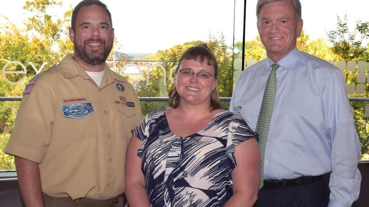 Anthony Berger, Scout Executive and CEO of Chattahoochee Council Boy Scouts of America, Sara Banks and Troy Woods, chairman and CEO of TSYS, attend the awards presentation Wednesday. Banks was presented with the Phil Tomlinson Heart of TSYS Award for her tireless volunteering work with the Boy Scout of America.