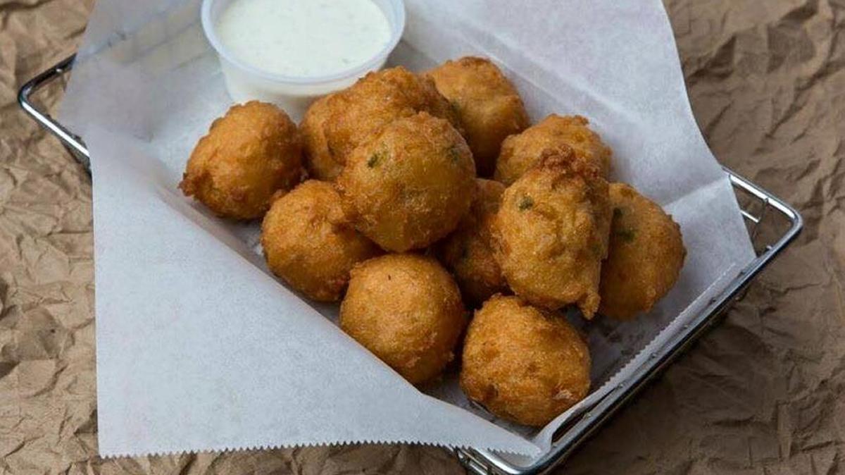 Ezell’s, which has restaurants in Columbus and Phenix City, is asking people to devour its hushpuppies to benefit PAWS Humane. --