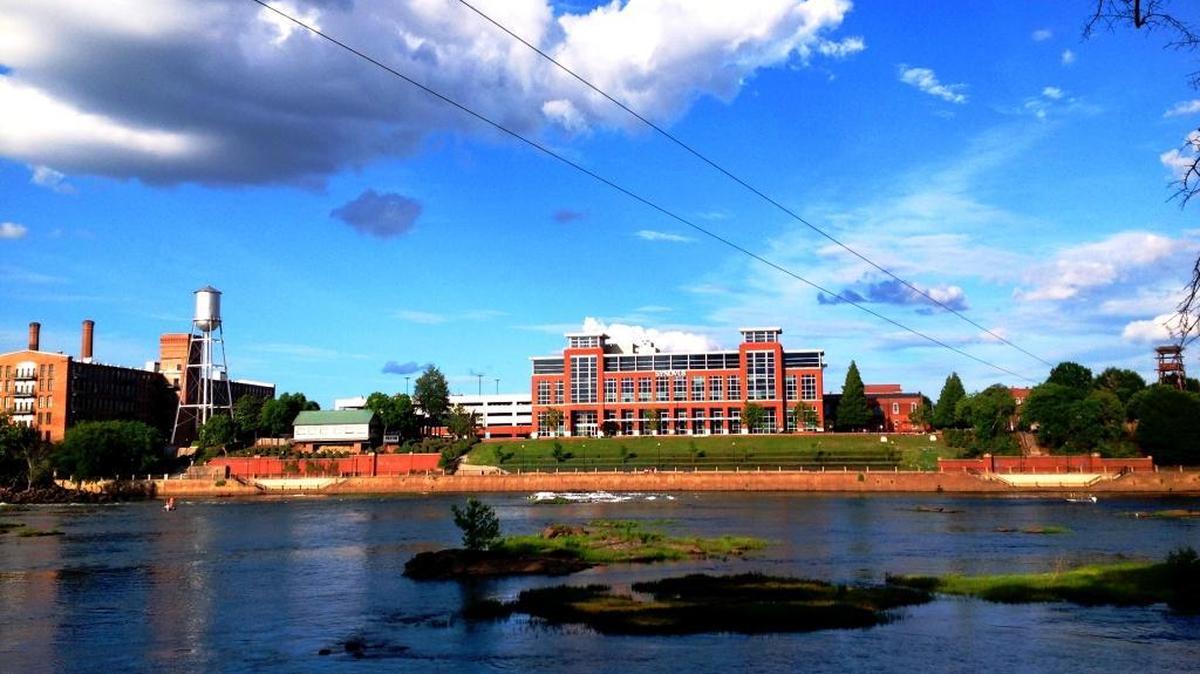 Sunlight reflecting off the Synovus building illuminates the Chattahoochee River.