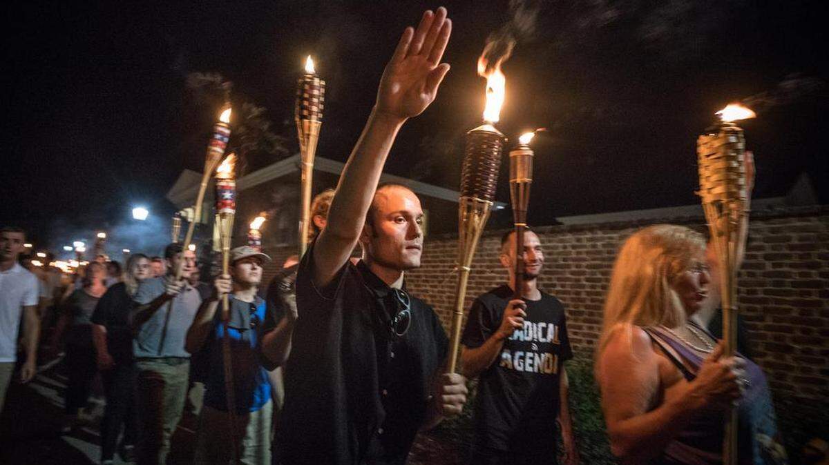 Chanting "White lives matter!" "You will not replace us!" and "Jews will not replace us!" several hundred white nationalists and white supremacists carrying torches marched in a parade through the University of Virginia campus on Aug. 11. MUST CREDIT: Photo by Evelyn Hockstein for The Washington Post.