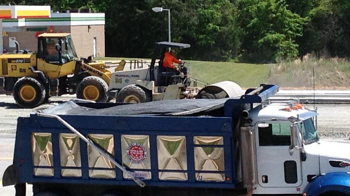 Construction crews and equipment, shown here Monday, have been a very familiar sight for Columbus-area residents traveling along north Veterans Parkway in recent years. The widening project started in 2014 and will be a year overdue when it is completed late this year, the Georgia Department of Transportation says. --