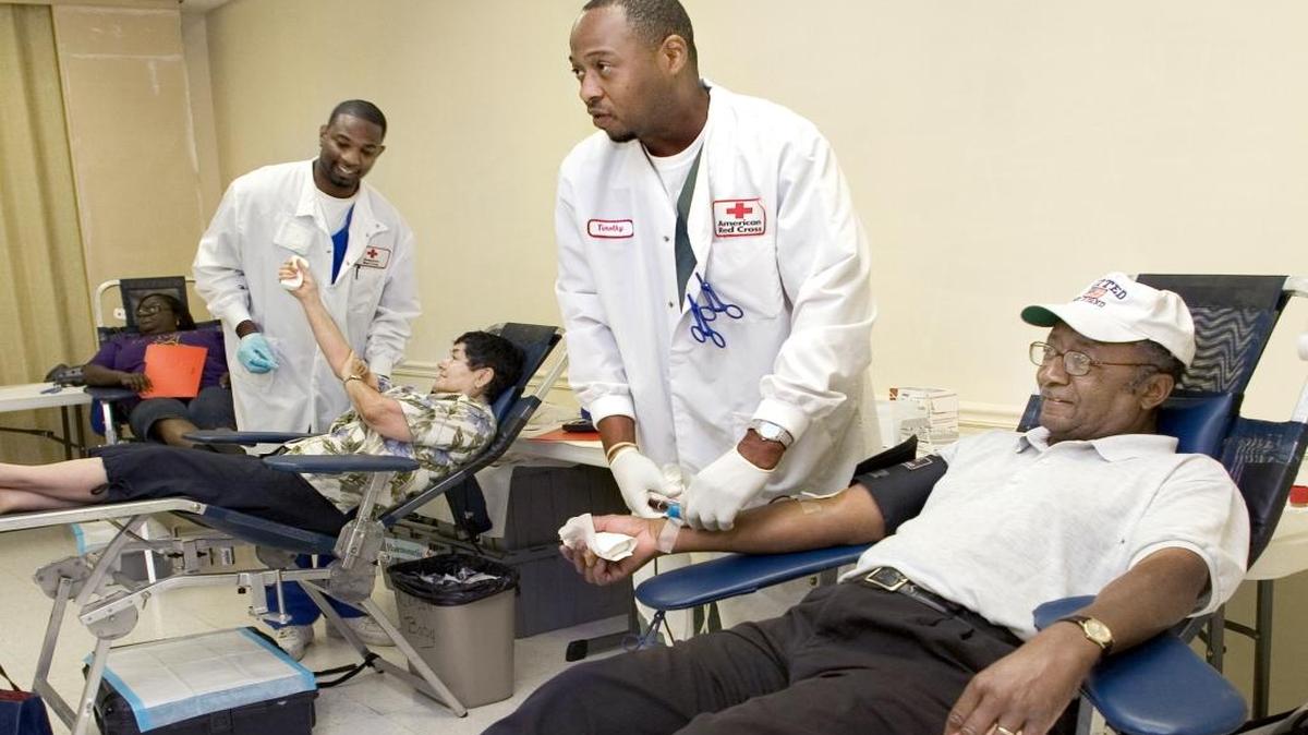 In this file photo, American Red Cross technicians take blood donations from local residents during a blood drive on Forrest Road in Columbus. --