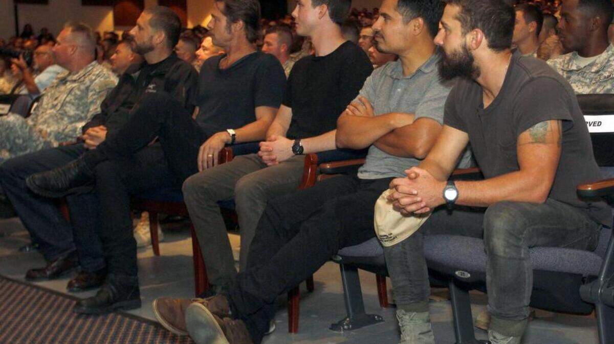 Joe Paull jpaull@ledger-enquirer.com The cast of 'Fury' consisting of writer director David Ayer, Brad Pitt, Logan Lerman, Michael Pena, and Shia LaBeouf prior to a screening of the film at Fort Benning Thursday afternoon.
