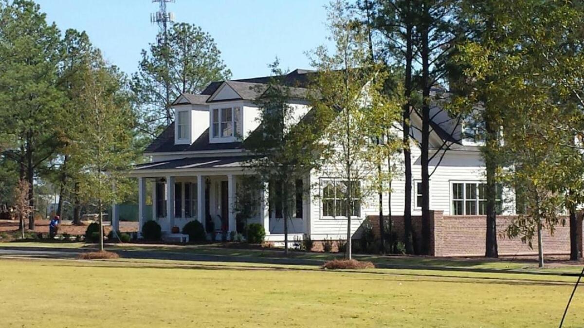 A classic Southern home is located just off the town square at Old Town in north Columbus. The 300-acre mixed-use property has been named the top Southern Living Inspired Communities development this year. --