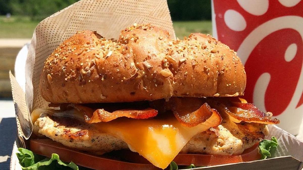 The Chick-fil-A menu includes a club sandwich with bacon and cheese. Some Chick-fil-A fans enjoy that with waffle fries and lemonade.